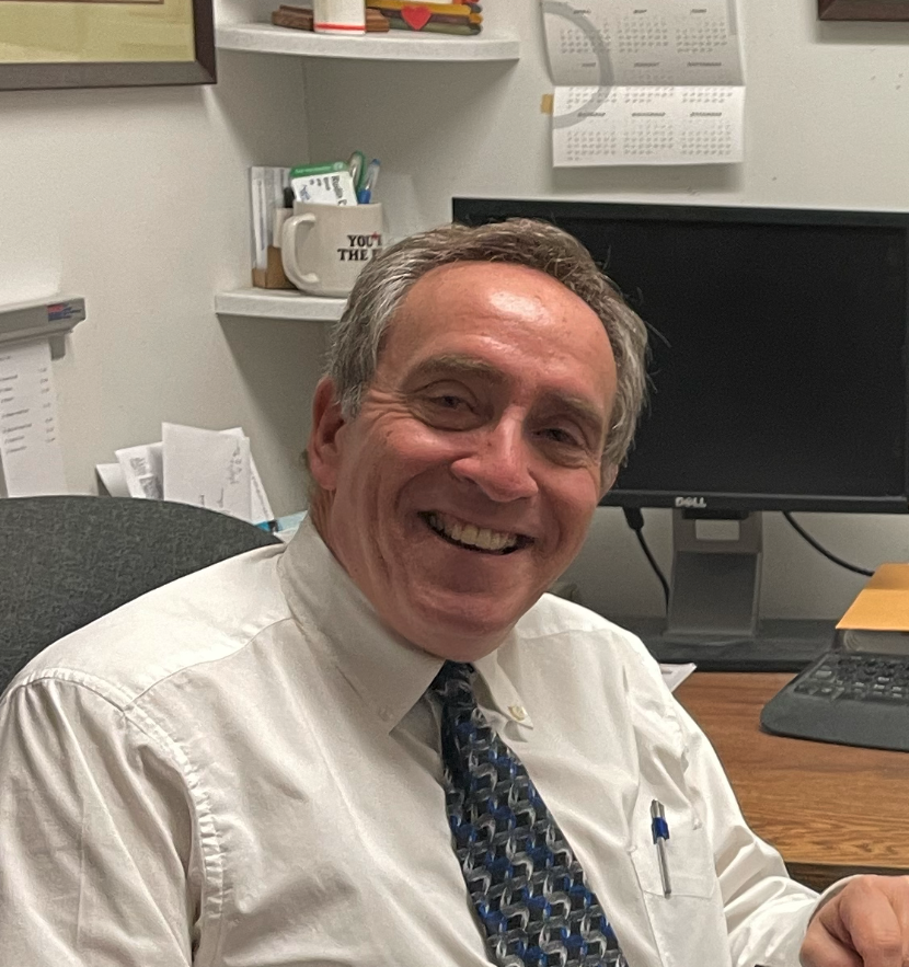 A image of a concrete sphere, balanced between two other larger spheres